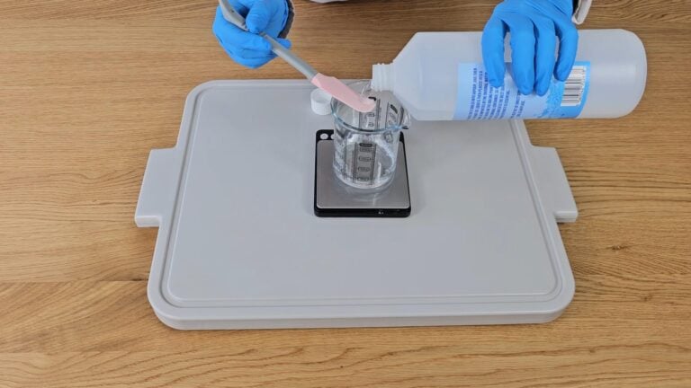 Pour the glucosides into the beaker with the water. Pour the glucosides into the beaker with the water.