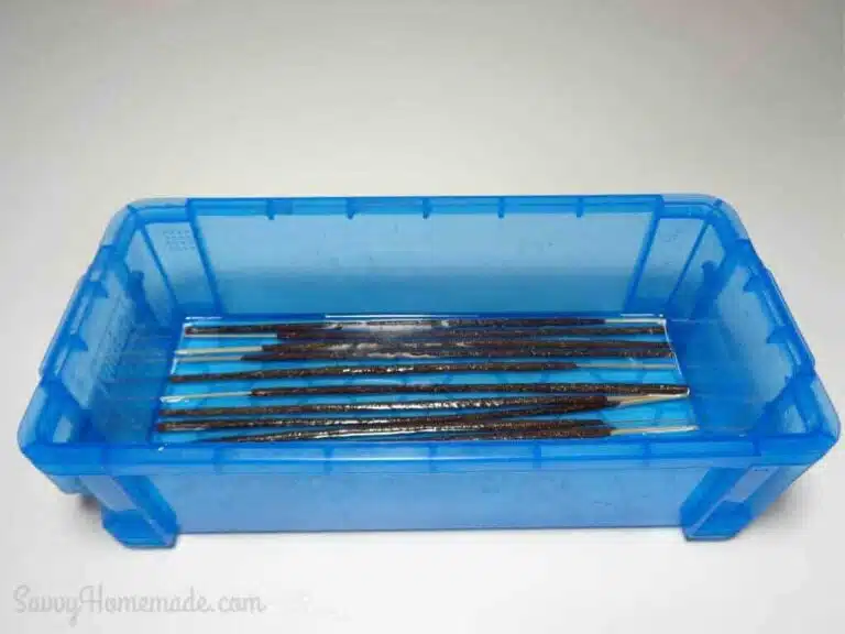 Take your sticks, in batches of 10, and soak them in the oil blend.