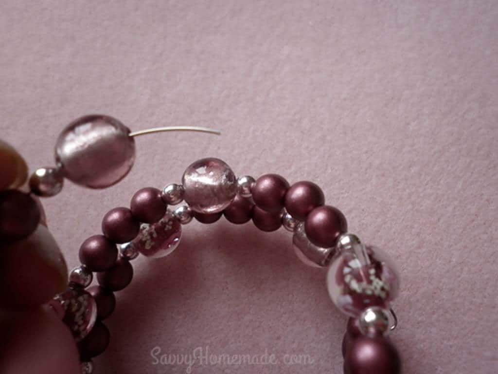 Thread one type of bead, then a different one, and then return to the previous bead type.