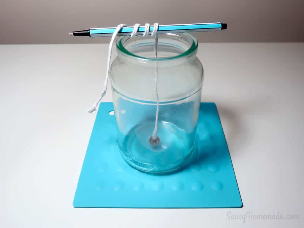 thread the wick through a pencil or wick holder