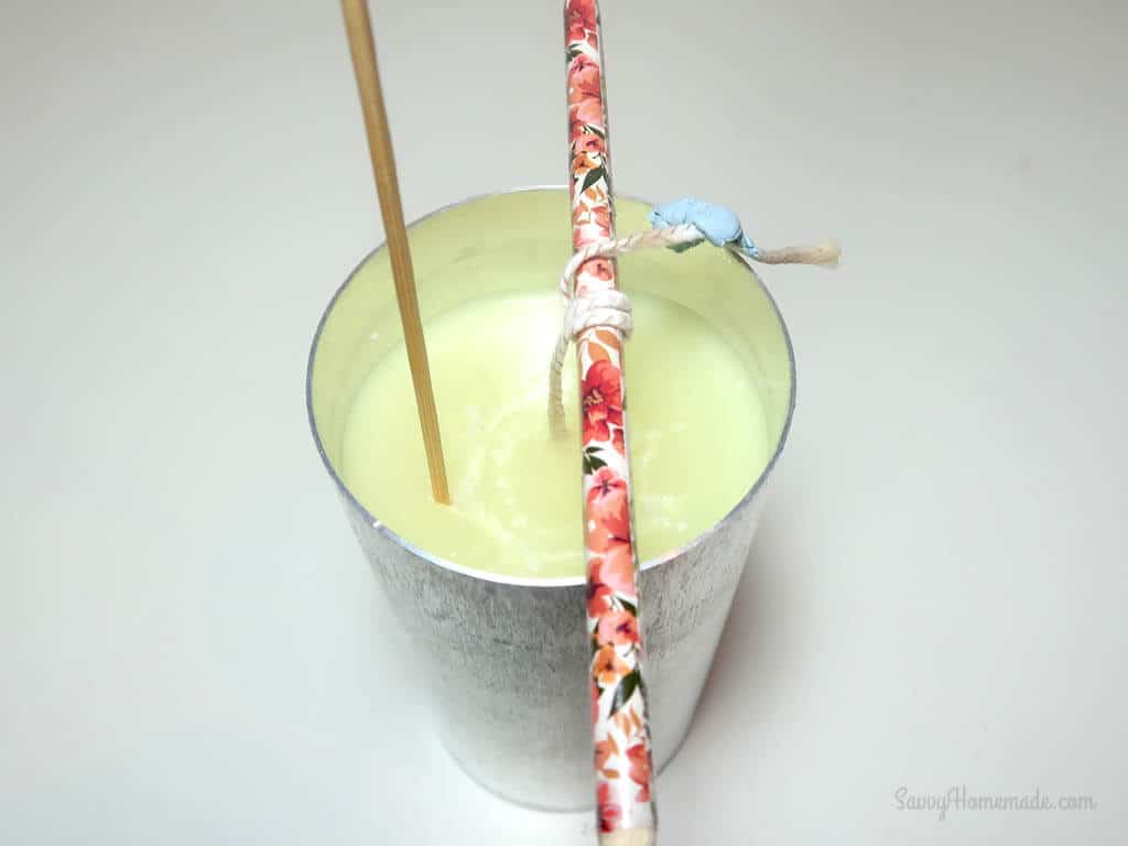 grab your skewer or bamboo stick and push vertically into your wax