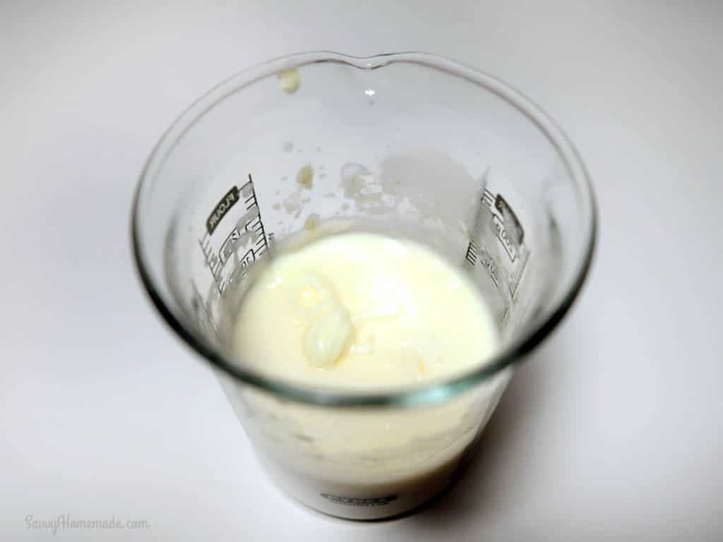 Once the rose essential oil has been added, your natural face cream should turn a lovely ivory color