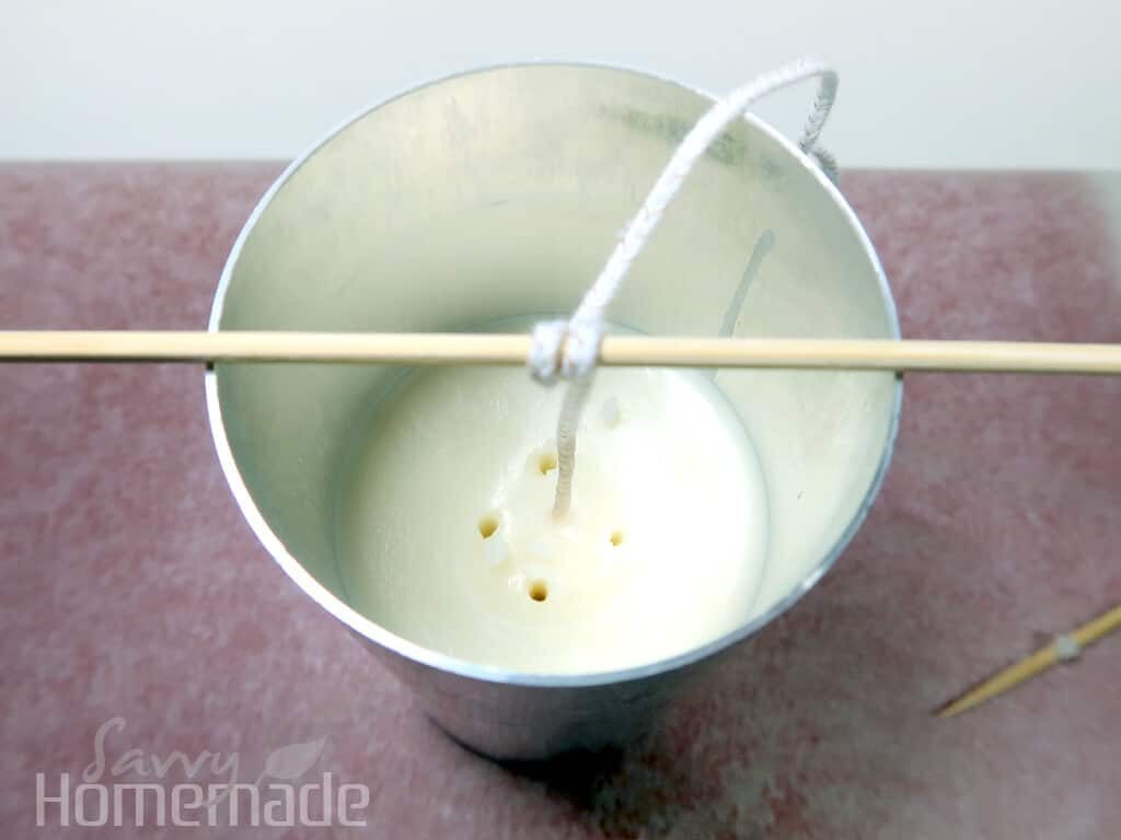 Fix sink holes by poking holes down into the wax, then topping up with wax