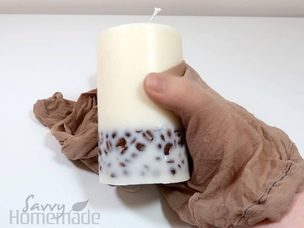 To make the coffee beans more visible, polish the candle with pantyhose