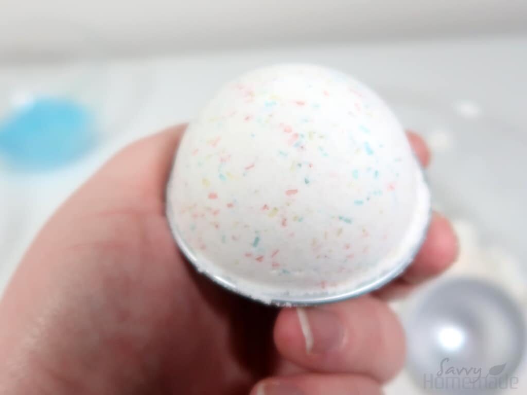 Remove one half of the bath bomb mold