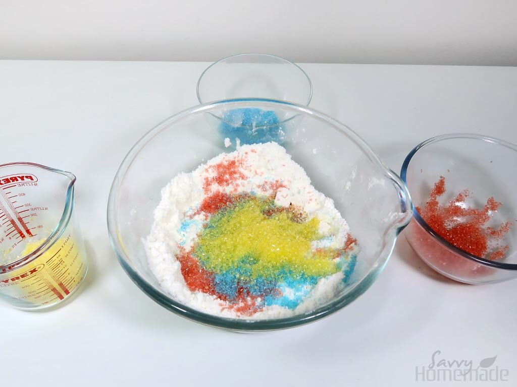 Add the dyed epsom salts to the bowl and mix thoroughly