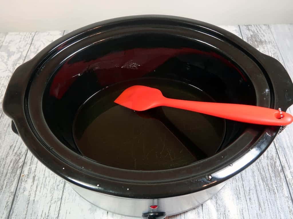 how to make liquid soap 1: Melt your oils and butters in a crock pot. You can save time by microwaving them instead