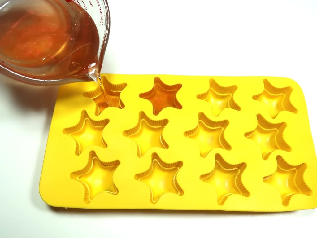 Pour your mixture into the mold, being careful not to spill.