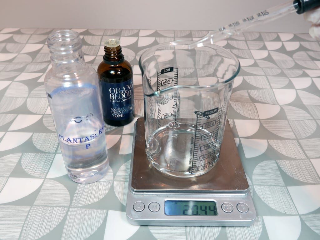 Step 3: In another beaker, combine your liquid surfactant with your essential oil and preservative, stir well