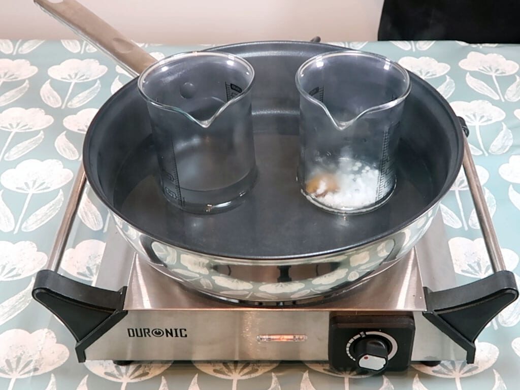 Two beakers sitting in a double boiler