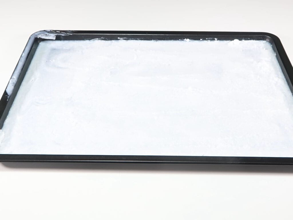 Hardened coconut oil in a baking tray