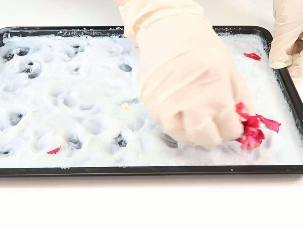 Petals being removed from coconut oil