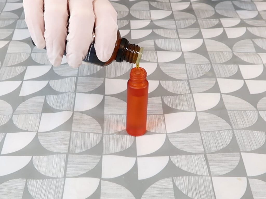 Essential oil being added to a roller bottle