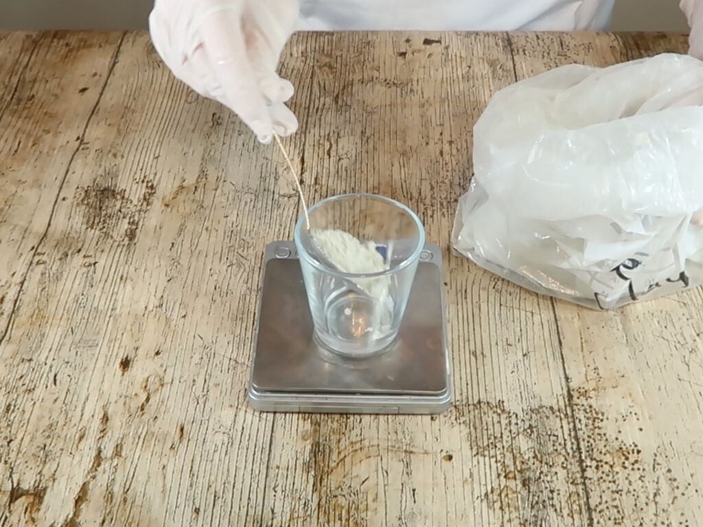 Bentonite clay is measured in a beaker