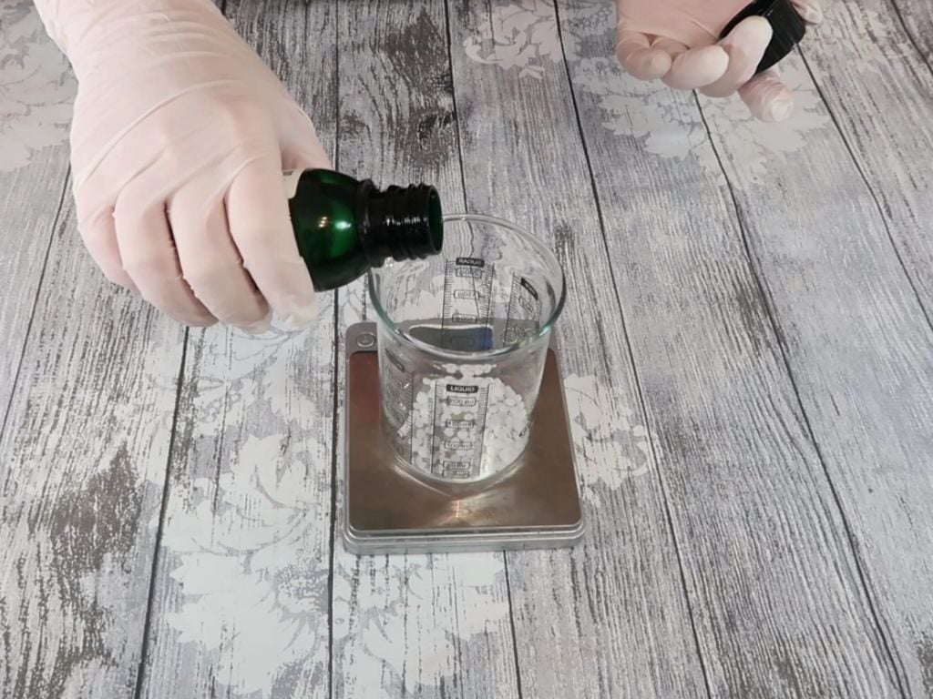 Oil is added to a beaker