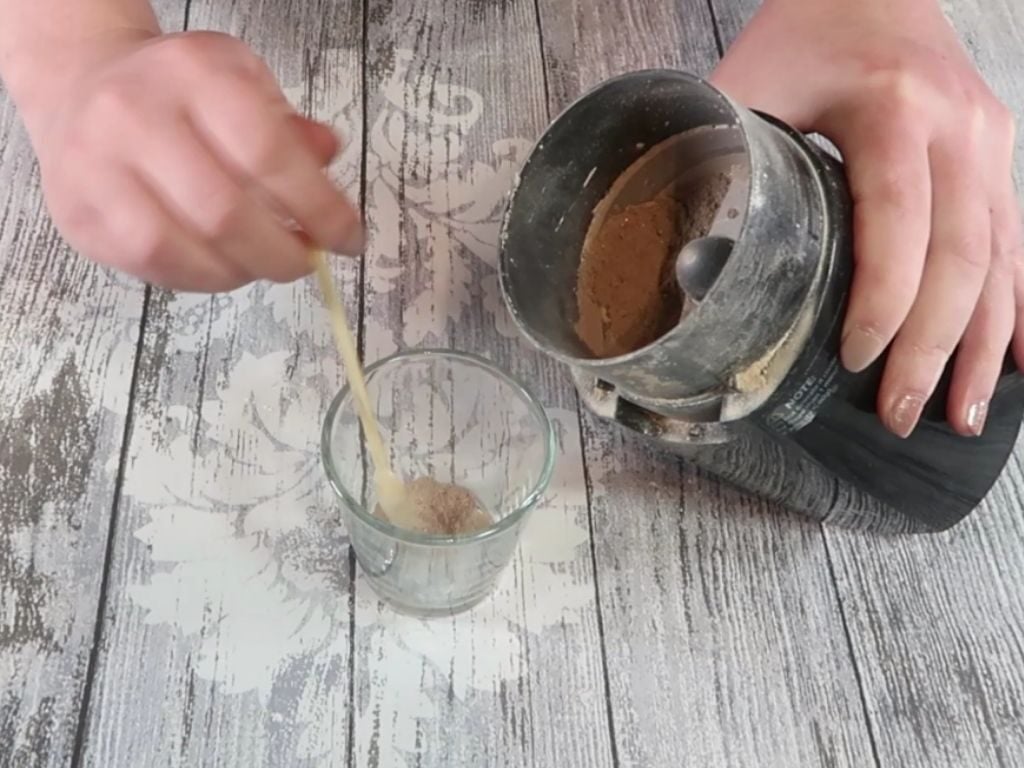 Half of the contents of the grinder is removed and placed to one side to use later