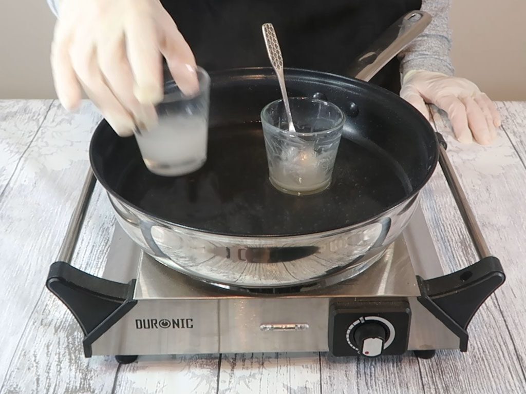 Once the oil part has fully melted, both containers are removed from the water bath