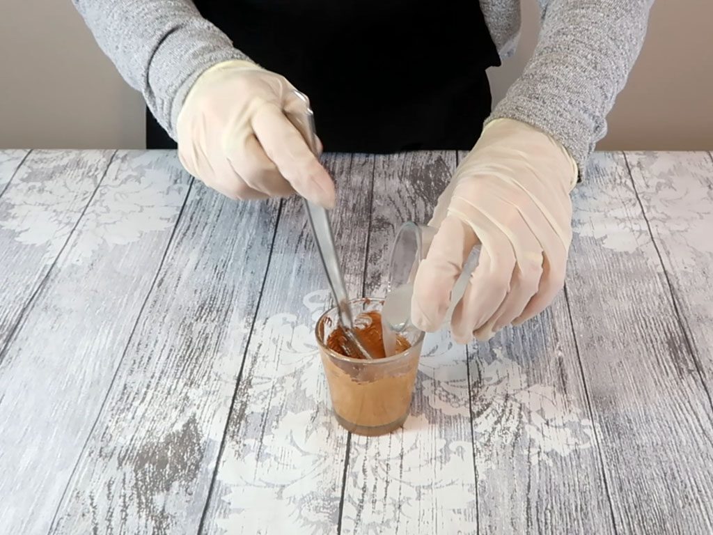 The water part is added to the oil part and pigment mixture