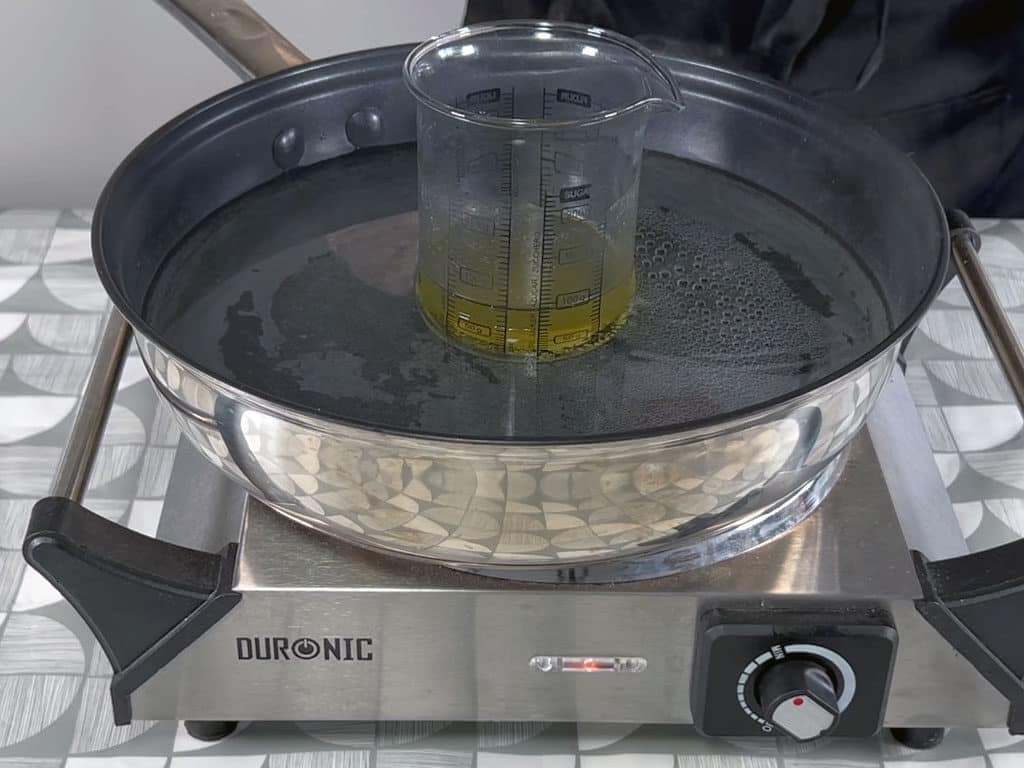 Create a water bath by filling a shallow saucepan with a couple of inches of water