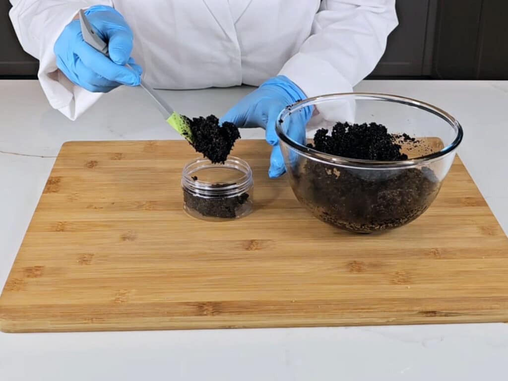 Transfer coffee scrub into a container