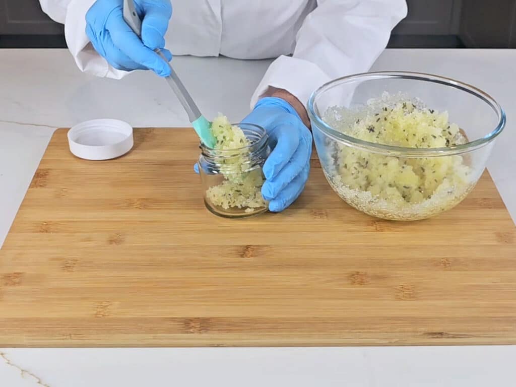 Spoon scrub into a suitable container