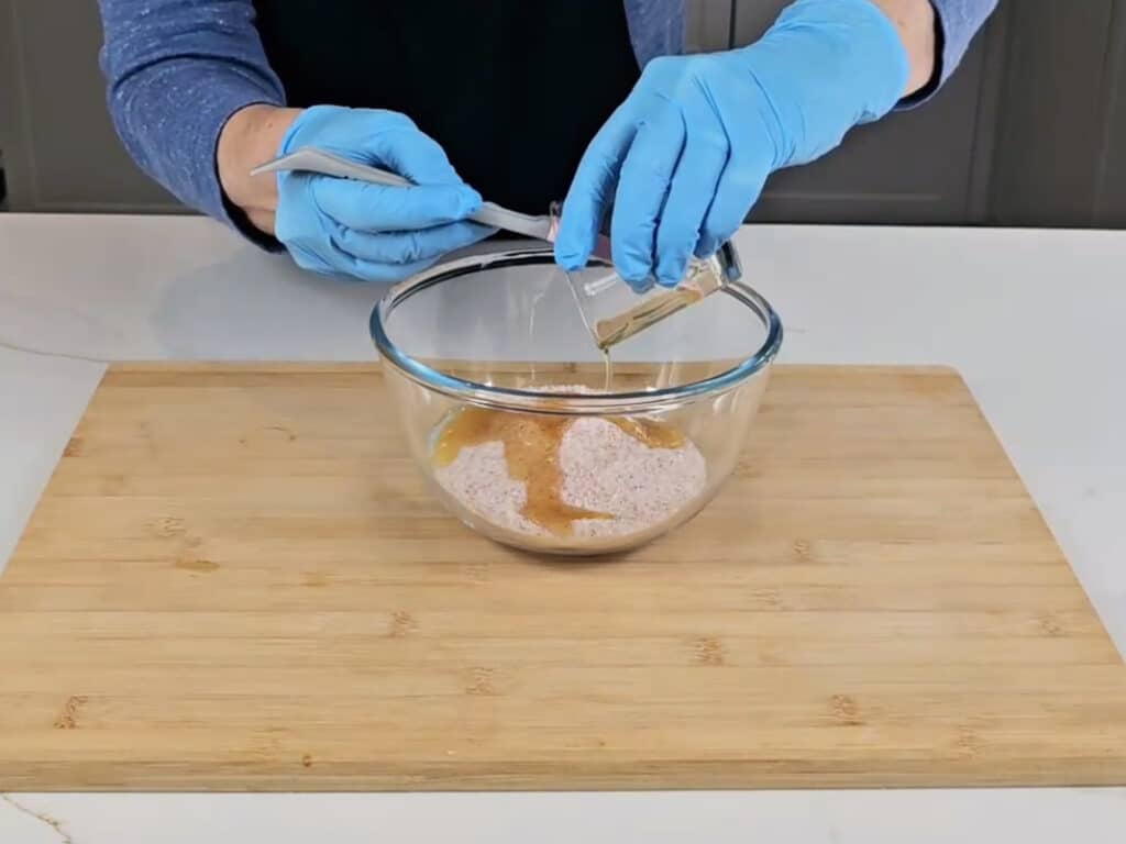 Pour the oils into the salt and mix until fully combined.