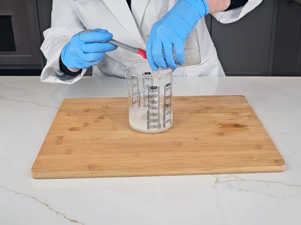 Pour the watery gum into the surfactants