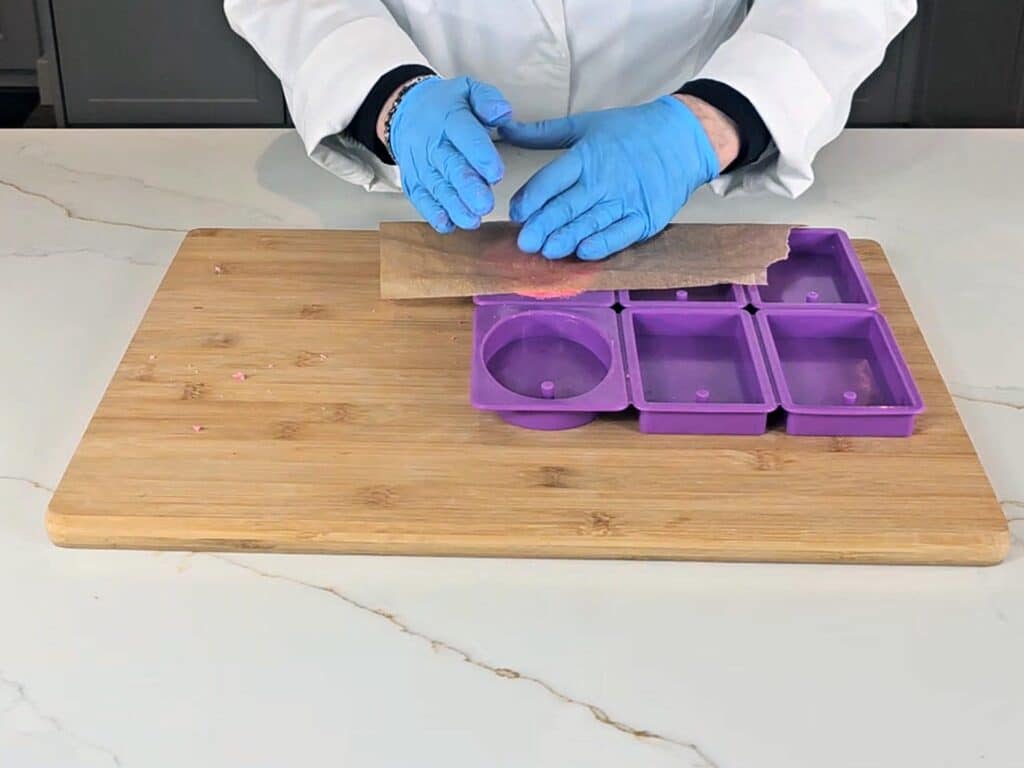try placing a piece of wax paper over the dough and smoothing it down with the palm of your hand