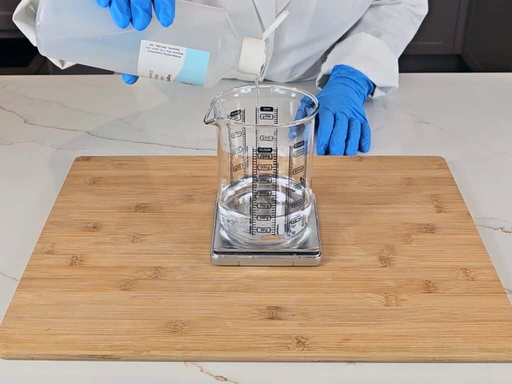 The water phase ingredients are measured in a beaker