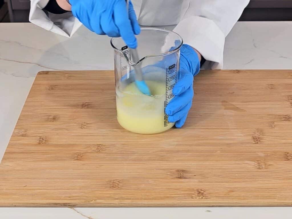 The mixture is stirred with a spatula to bring together the emulsion