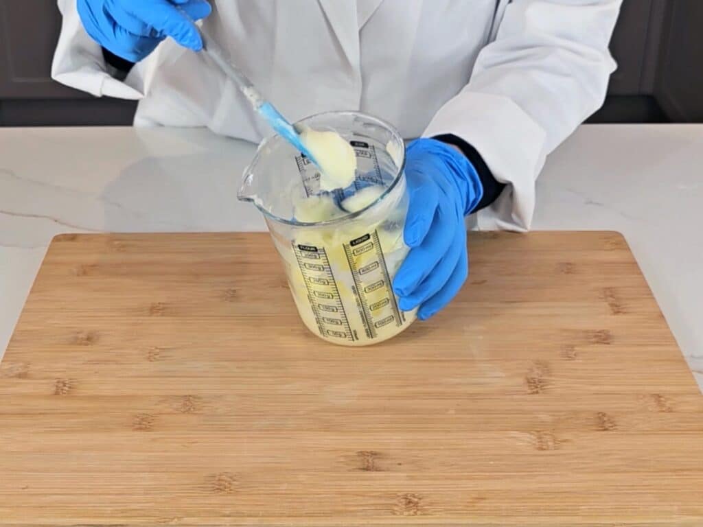 The mixture has emulsified, cooled and increased in viscosity