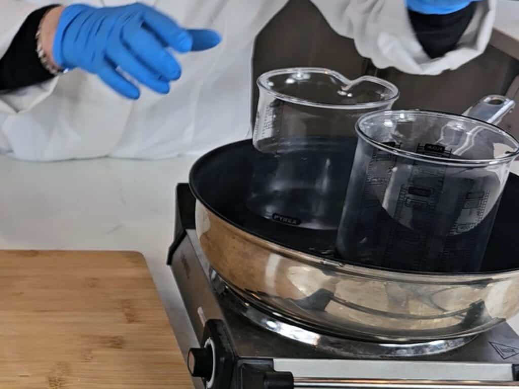 Both phases are lowered into a water bath to allow our solid ingredients to melt