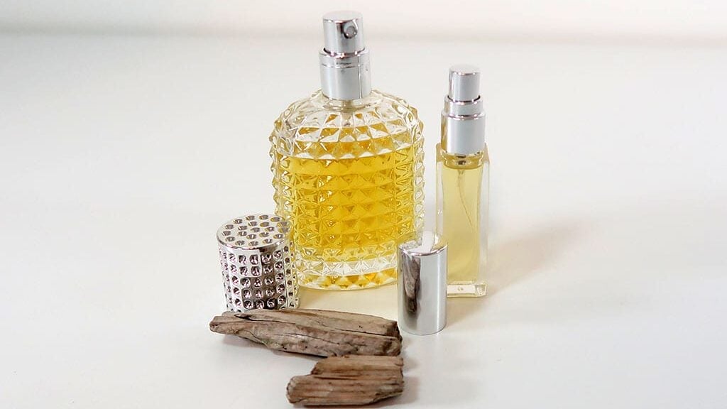 Eau de parfum, sitting next to some wood