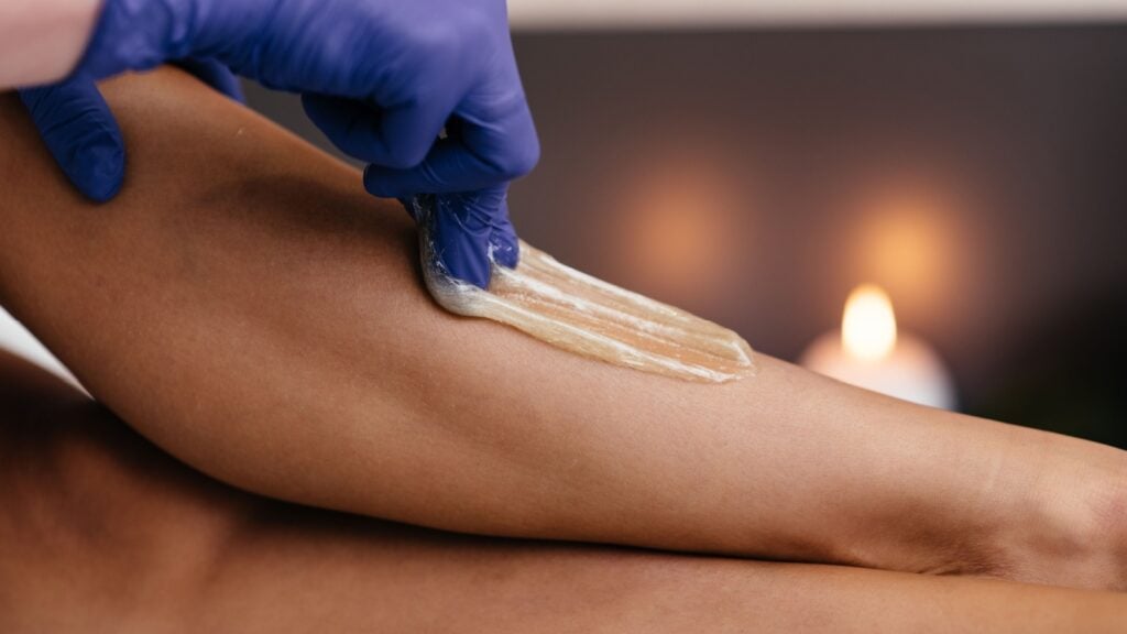 women sugar waxing her leg women sugar waxing her leg