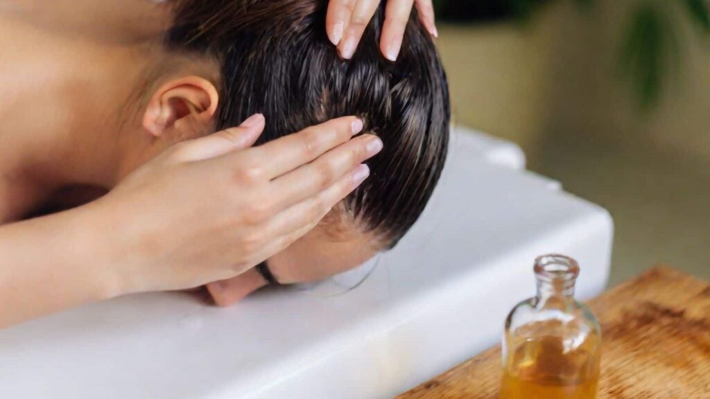 rinsing a woman's hair