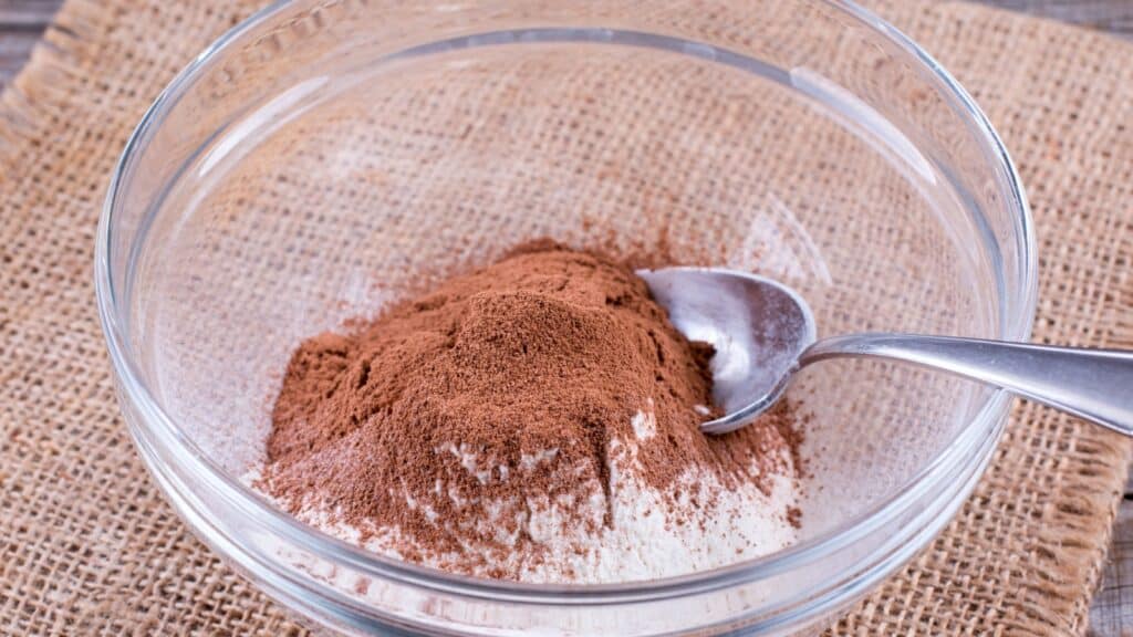 Small white porcelain bowl with cocoa powder and cornstarch