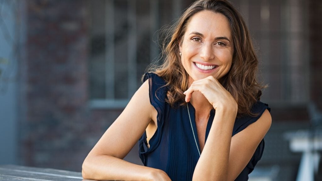beautiful mature woman sitting at coffee shop