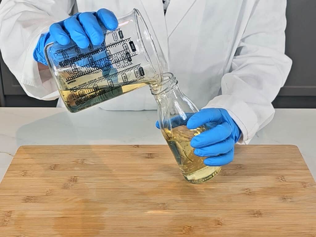 The mixture is then poured into a bottle for easier storing and application