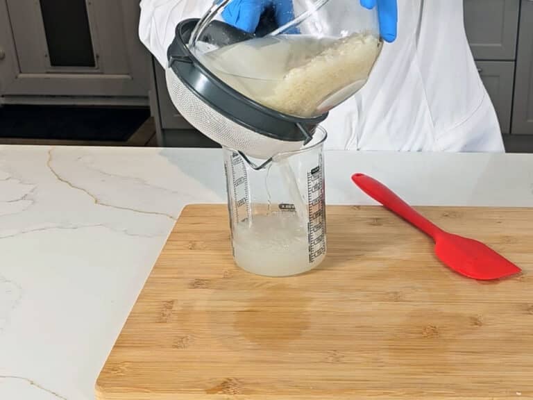 A strainer is used to seperate the water from the rice