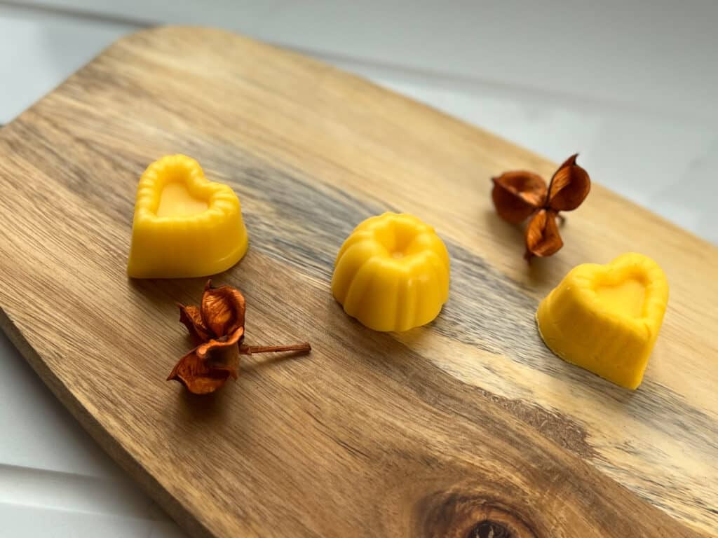 3 mango conditioner bars sit on a wooden board