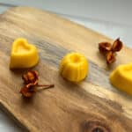 3 mango conditioner bars sit on a wooden board