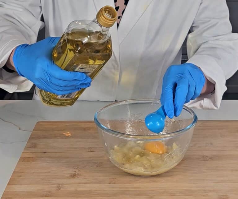Oil and an egg yolk is added to the mashed banana