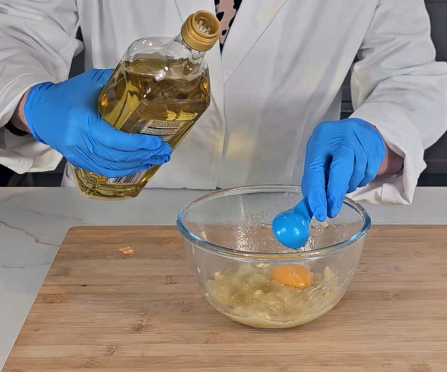Oil and an egg yolk is added to the mashed banana