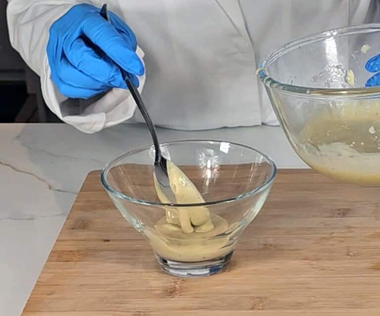 The mixture is spooned into a glass bowl to use