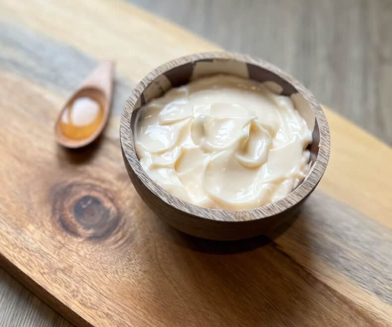 A small bowl of mayo in DIY hair care treatment