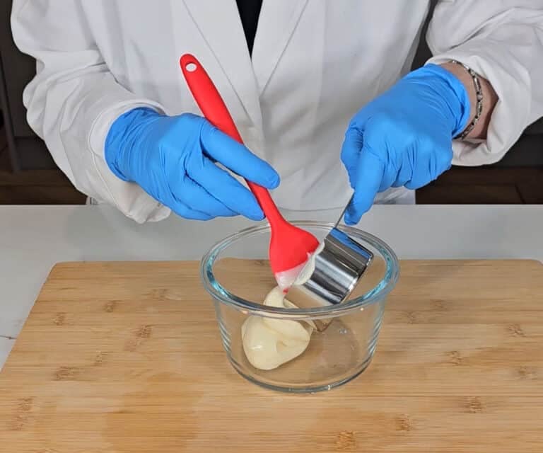 Mayo is measured into a mixing bowl