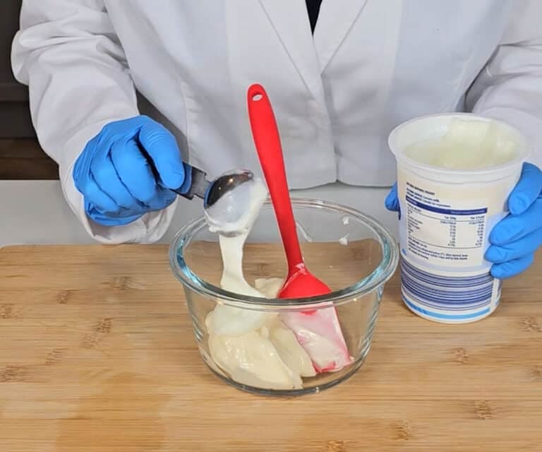 Natural yoghurt is added to the mixing bowl