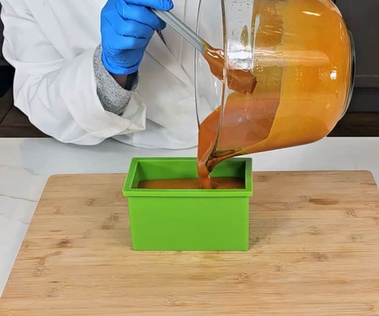 The soap batter is poured into a silicon soap mold.