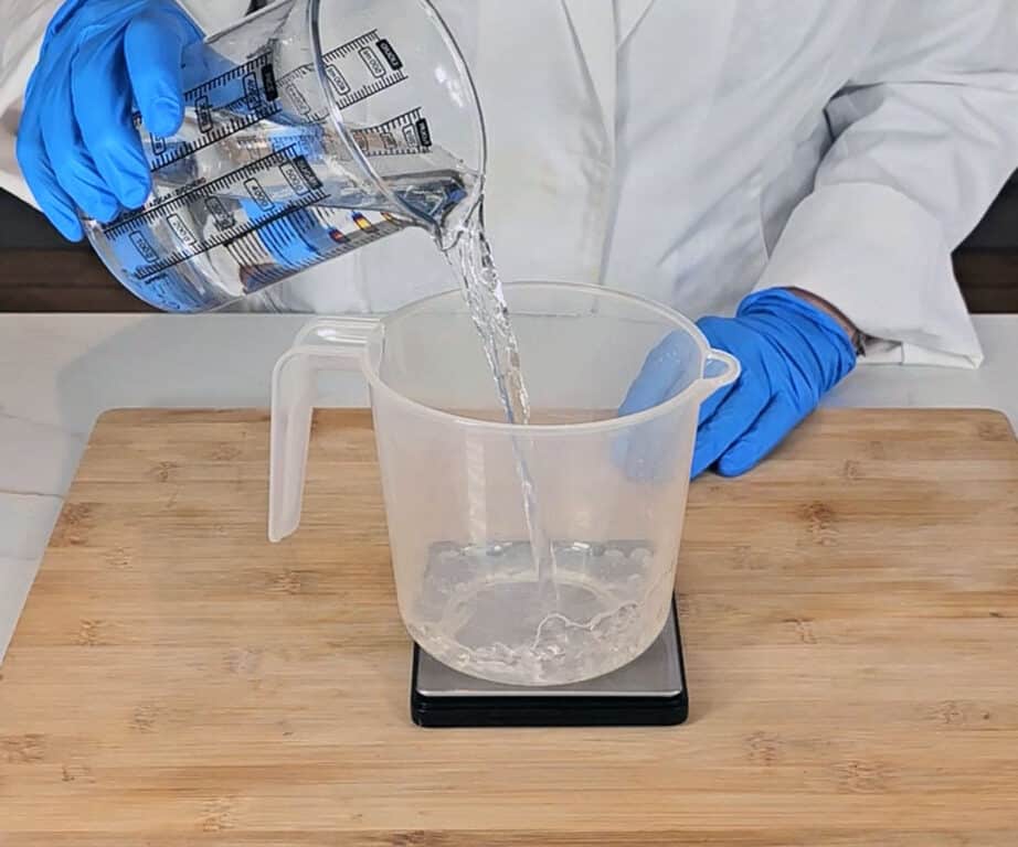 Distilled water is weighed into a PET plastic pitcher