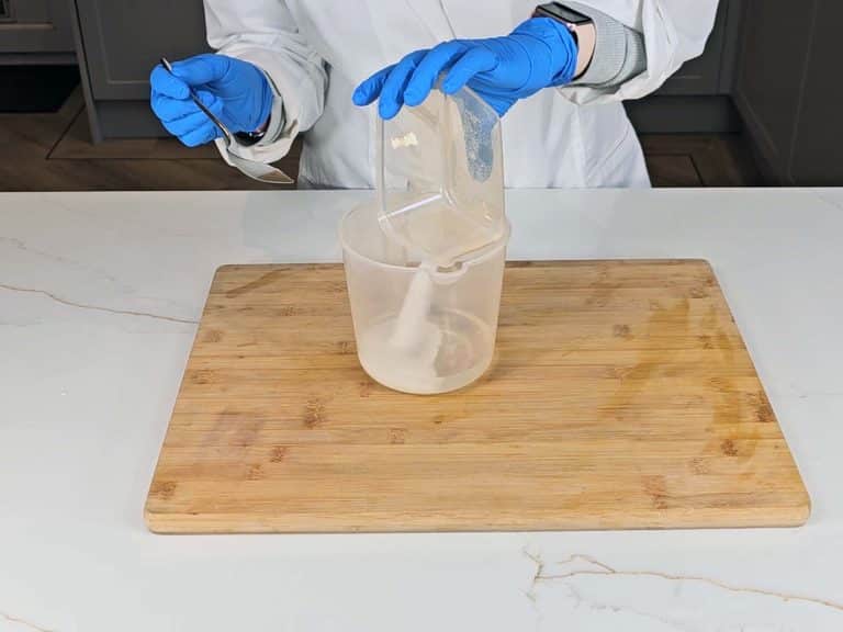 Sodium hydroxide is poured into distilled water to create liquid lye solution
